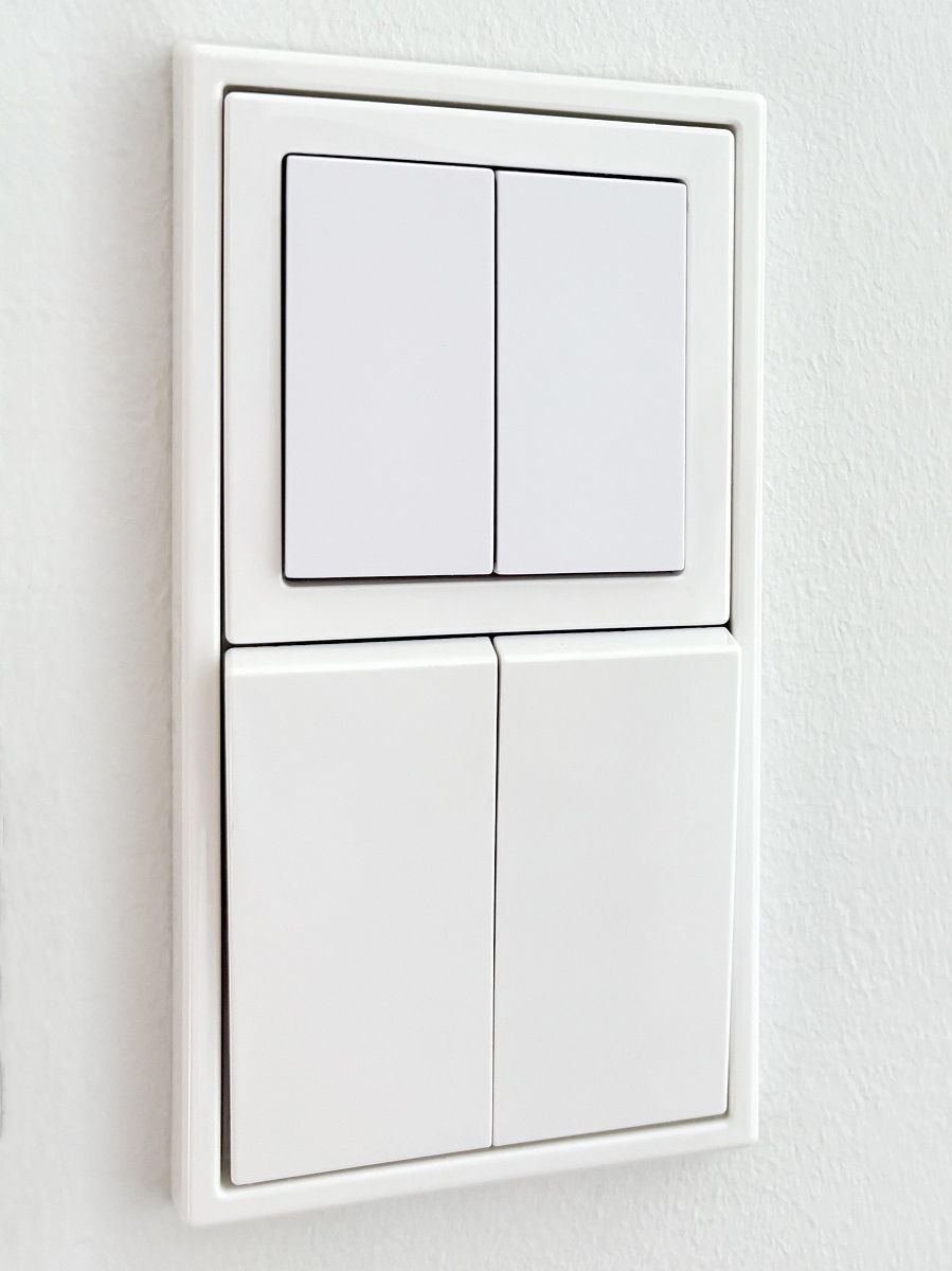 Smart lighting control buttons integrated with normal ones.